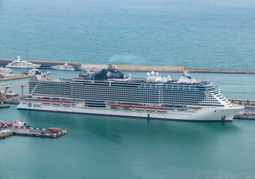 Barcelona, Spain - November 16, 2018: Aerial view from the Montjuic mountain on the cruise ship moored in the Port of Barcelona