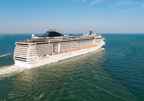 Cruise ship vacation. Travel at sea. Aerial drone view luxury liner. Ship leaving Miami port. Travel destination. Cruise ship vacation. Aerial cruise ship in vacation summer. Open sea